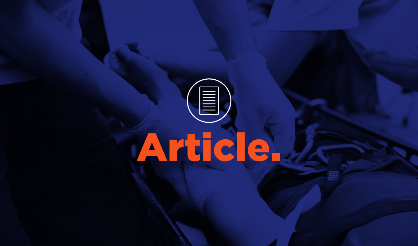 Article thumbnail showing emergency responders bandaging an injured arm during first aid treatment.