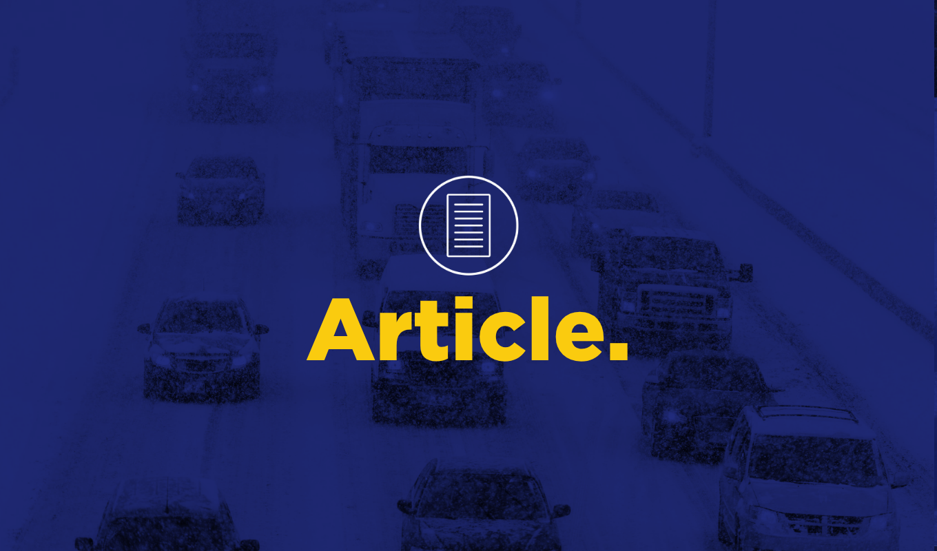 Article thumbnail showing vehicles traveling on a snow-covered highway during winter weather.