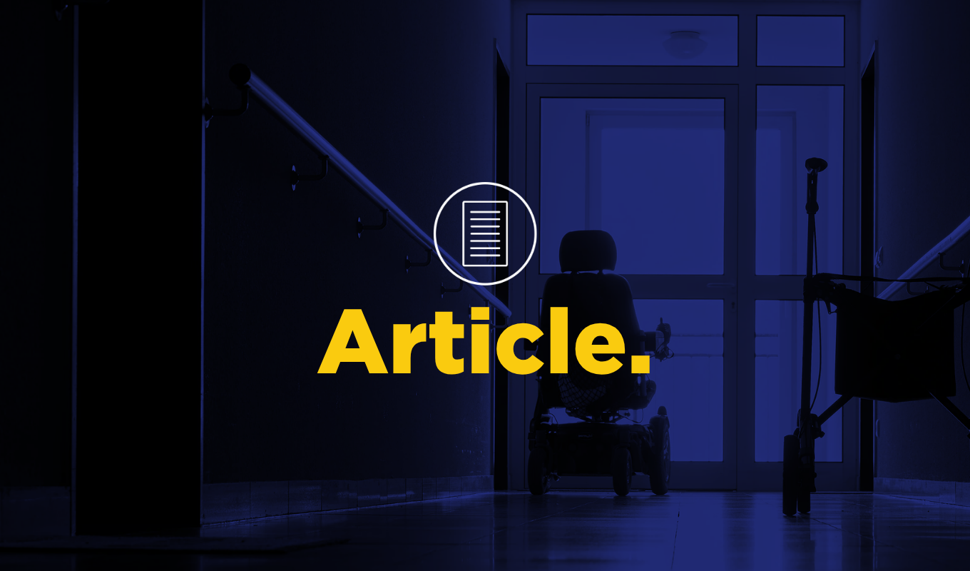 Article thumbnail showing a wheelchair in a healthcare facility hallway.
