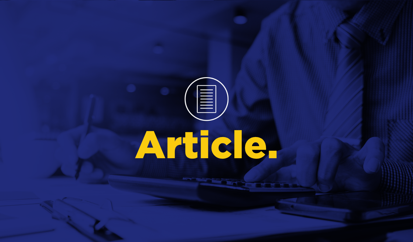 Article thumbnail with a blue-tinted image of a professional using a calculator and writing notes.