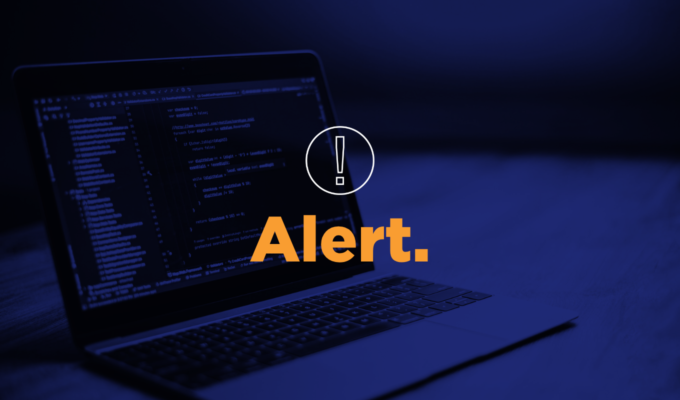 Cybersecurity alert graphic showing a code-filled laptop, warning icon, and bold orange “Alert.” text.