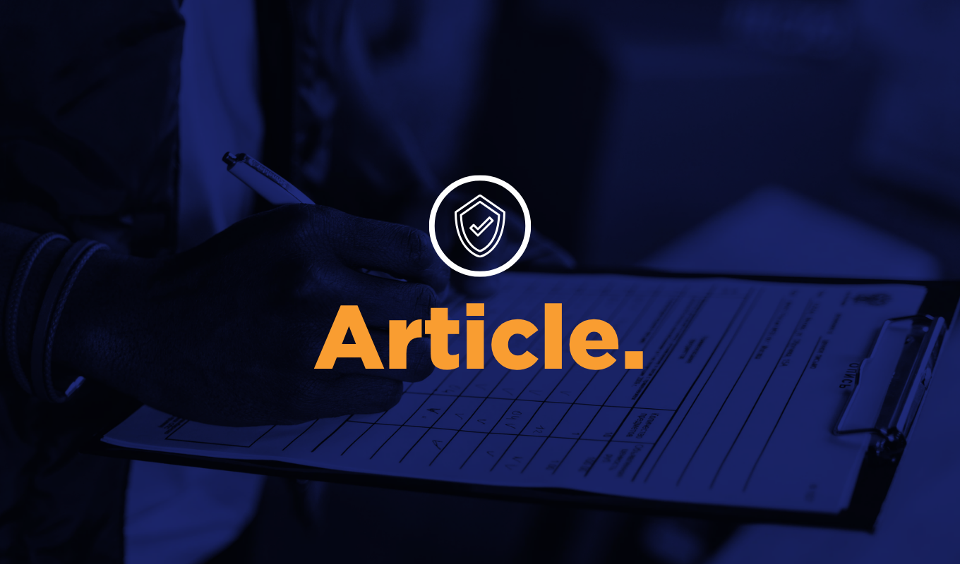 Hand completing a checklist on a clipboard, with a shield checkmark icon and the word “Article.”
